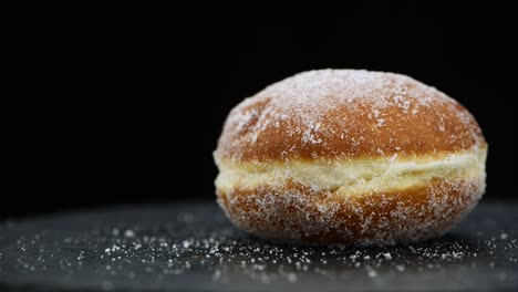 fresh made berliner doughnuts rotating on a plate (seamless loopable)