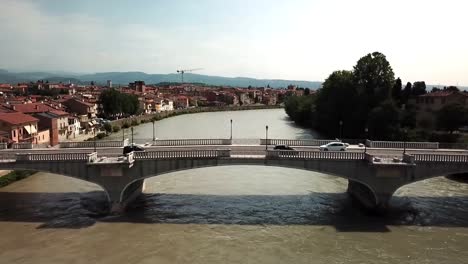 slow fly over bridge. adige river, verona italy