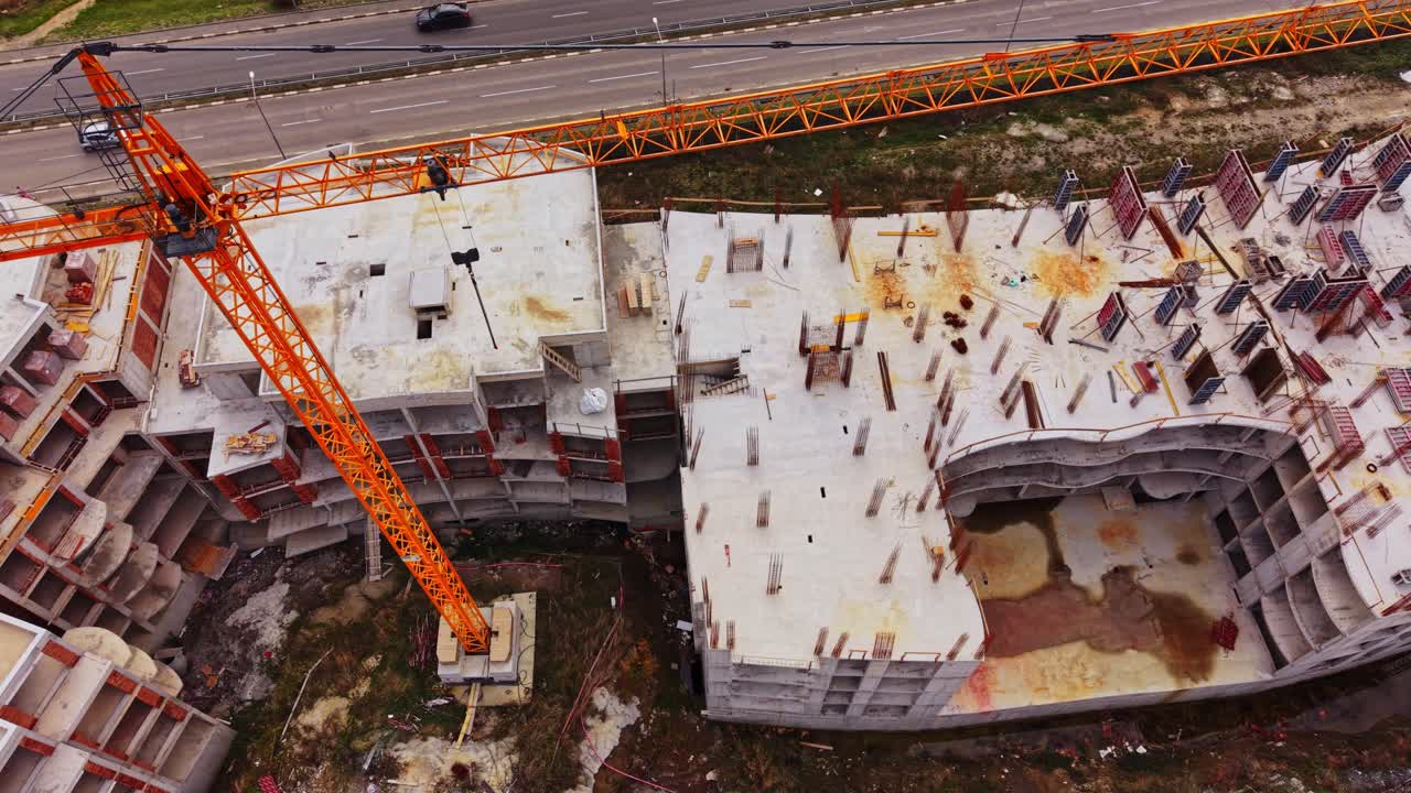 Construction site overview showing crane and building progress in city