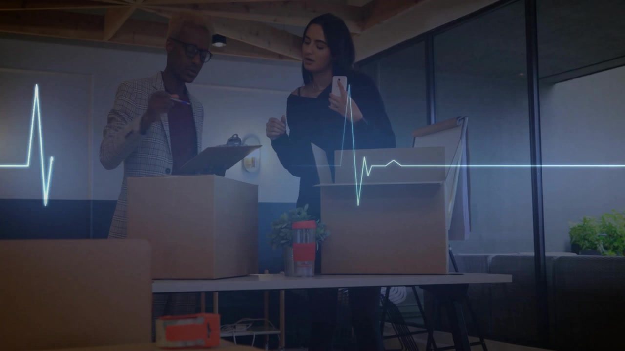 Woman speaking on smartphone activating ECG pulsing while man entering carrying box for inventory
