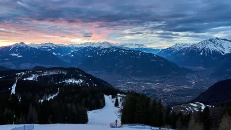 awesome snow capped mountain sunset timelapse in the alps, overlooking merano in winter.