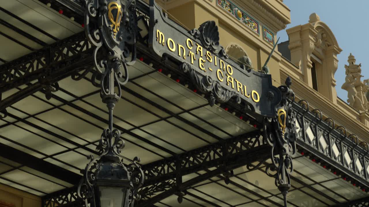 Slow revealing shot of the front of the Monte Carlo Casino in Monaco