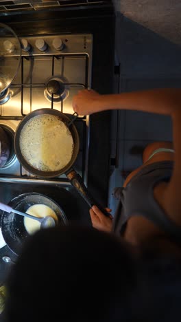 woman cooking pancakes