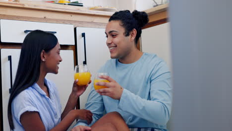 Couple,-cheers-and-kiss-in-kitchen-with-happiness