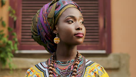 Close-Up-Of-The-Face-Of-The-Pretty-Young-Woman-In-The-Traditional-Outfit-Looking-At-The-Side-And-Smiling-To-The-Camera