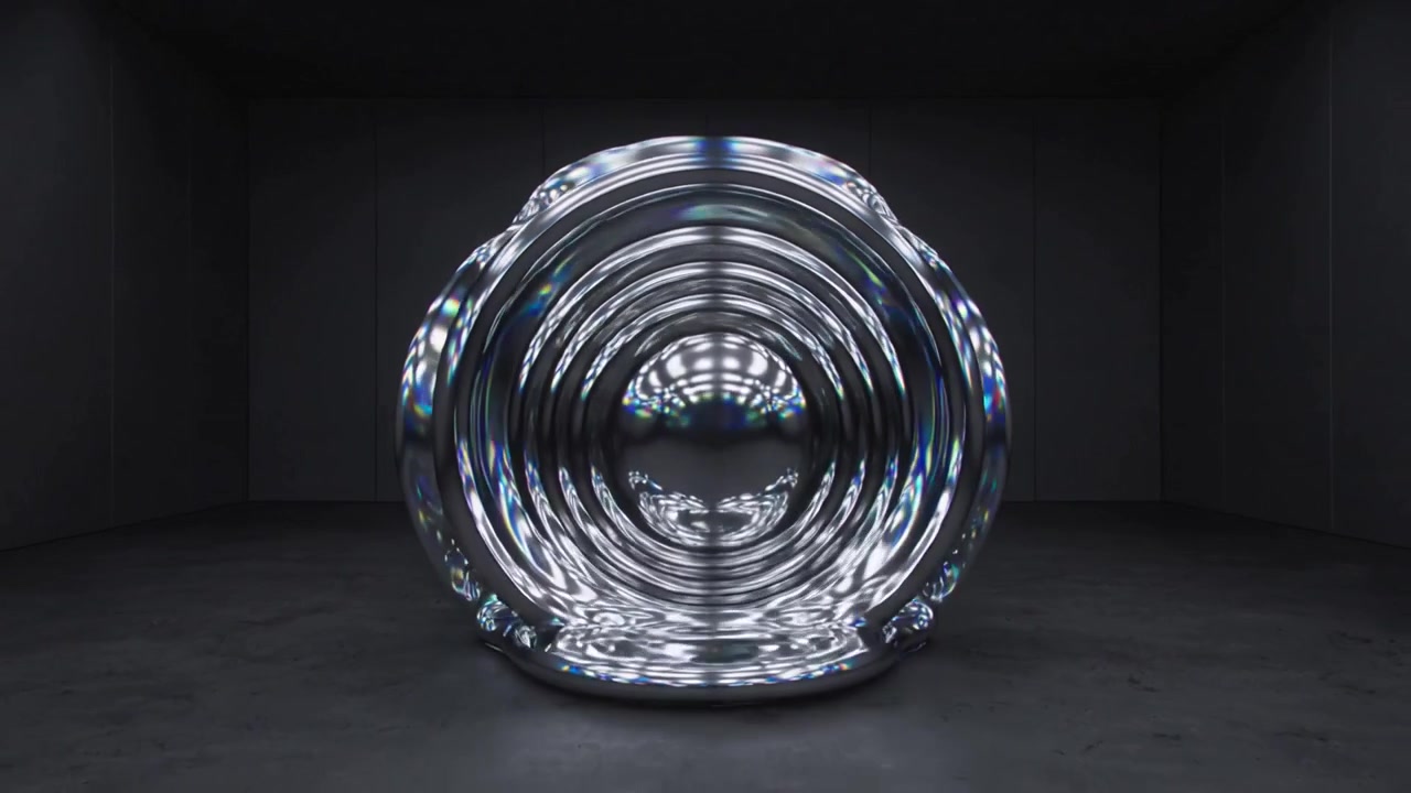 Scultura riflettente che si trasforma reagendo a una luce ad anello su un pavimento di cemento in studio, formando un tunnel.