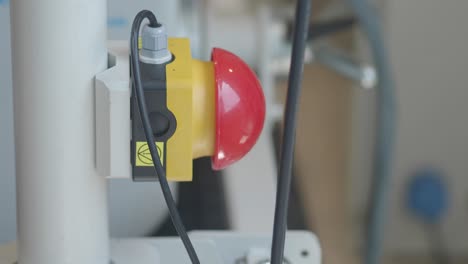 red and yellow emergency stop button