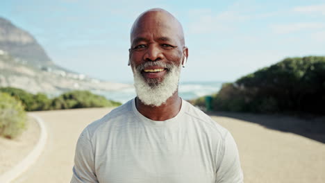 portrait of a smiling senior man exercising outdoors