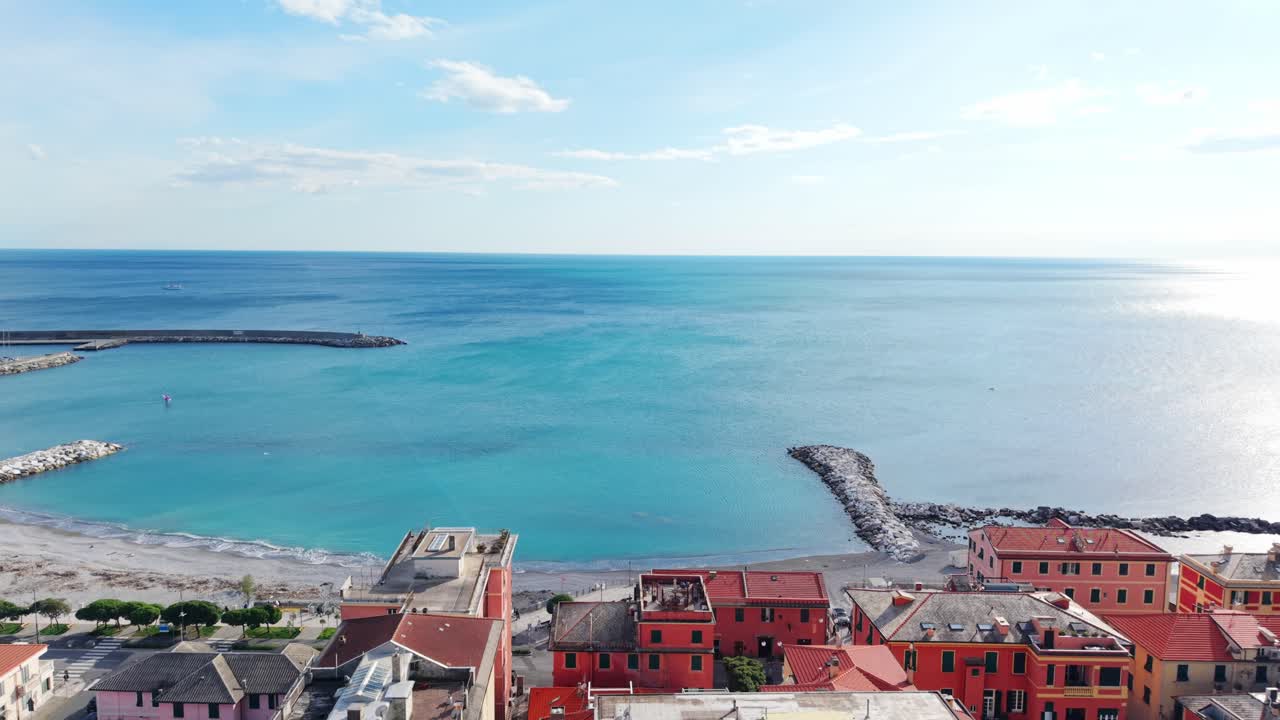 Coastal town in Italy, aerial view of colorful buildings and turquoise sea, serene mood