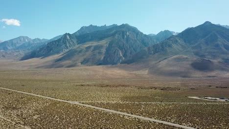 drone aerial view on scenic alabama hills and desert valley under summer sun