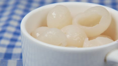 longans fruits in a small cup on table ,