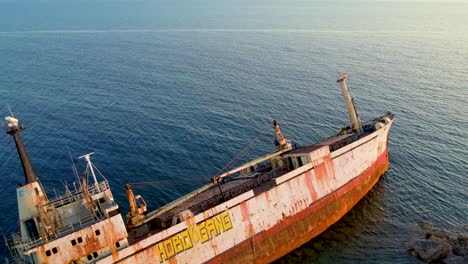 Aerial-shot-of-the-Edro-III-Shipwreck-at-golden-hour,-Paphos,-Cyprus