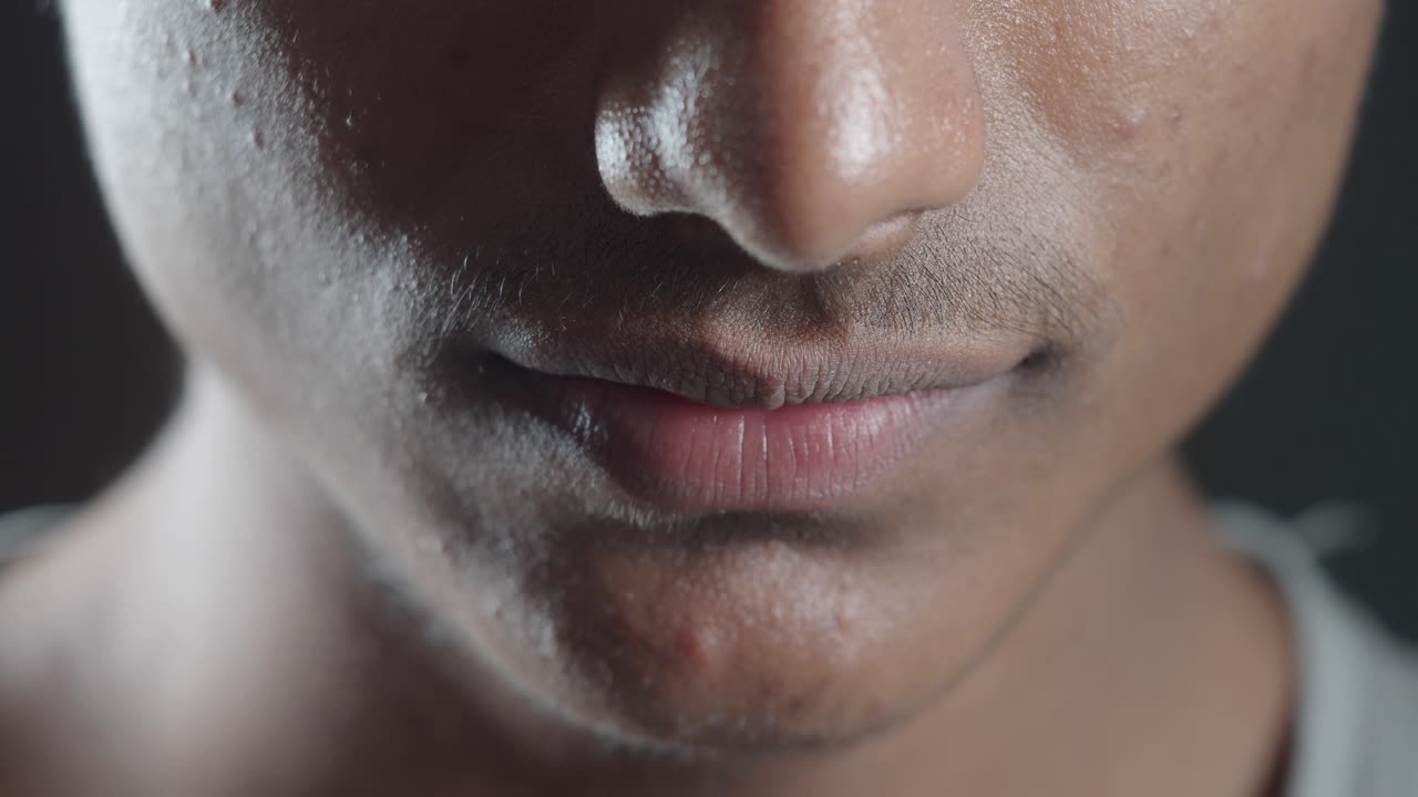 Close-up of a man's face and mouth