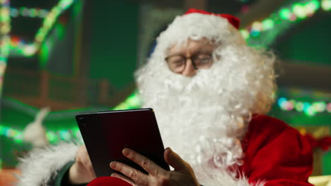 santa claus using a tablet