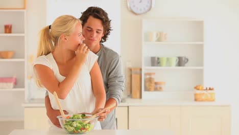 Happy-couple-preparing-thier-salad