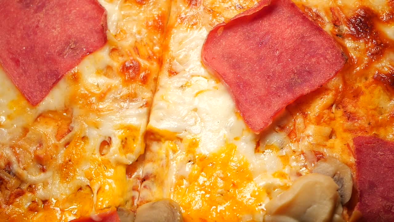 Close-up of Pizza with Salami and Mushrooms