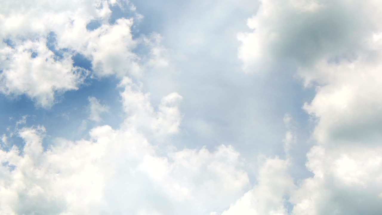 flight over white clouds under blue sky background, seamless loop ready