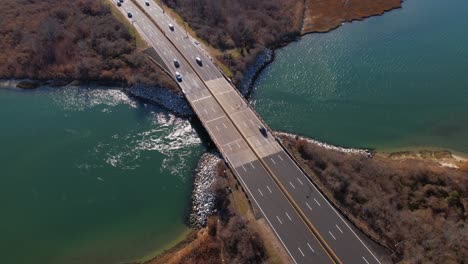 An-aerial-view-over-a-highway-on-Long-Island,-NY-on-a-sunny-day