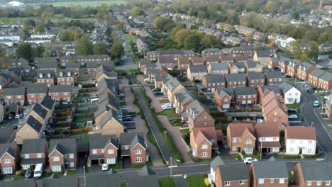 property ladder new british housing estate aerial view overlooking rooftops zoom out reveal