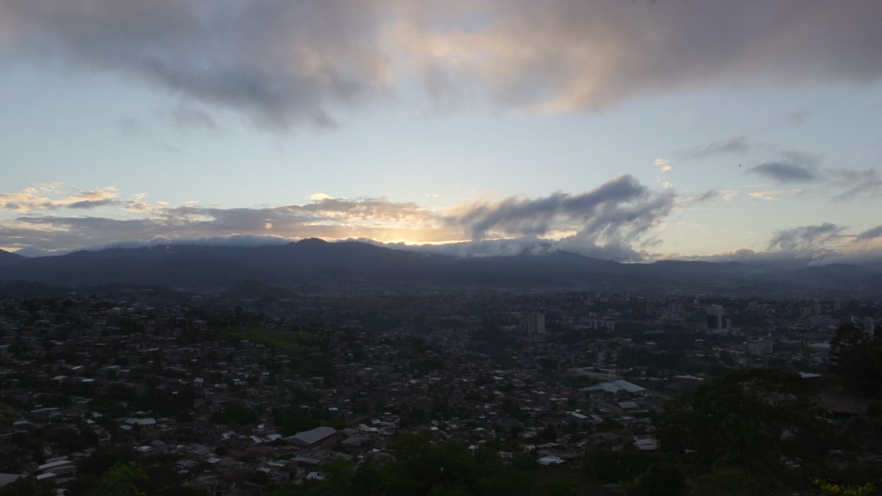 The sun about to rise over the mountains near Tegucigalpa, Honduras. Wide Shot