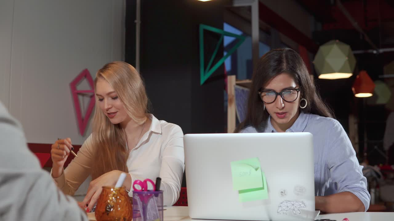 Two women collaborating in a modern office