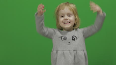 Kid-girl-on-a-Green-Screen,-Chroma-Key.-Happy-three-years-old-girl