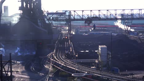 establishing shot of a busy steel mill 1