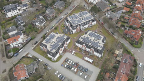 jib down of solar panels on top of large houses