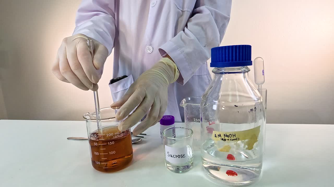 Scientist performs a chemical experiment using potassium permanganate, showcasing color change in a controlled lab environment