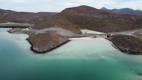 Aerial-dolly-shot-of-a-gorgeous-beach-with-turquoise-sea-at-Playa-El-Tecolote-in-Baja-California-Sur-Mexico-during-a-dream-trip