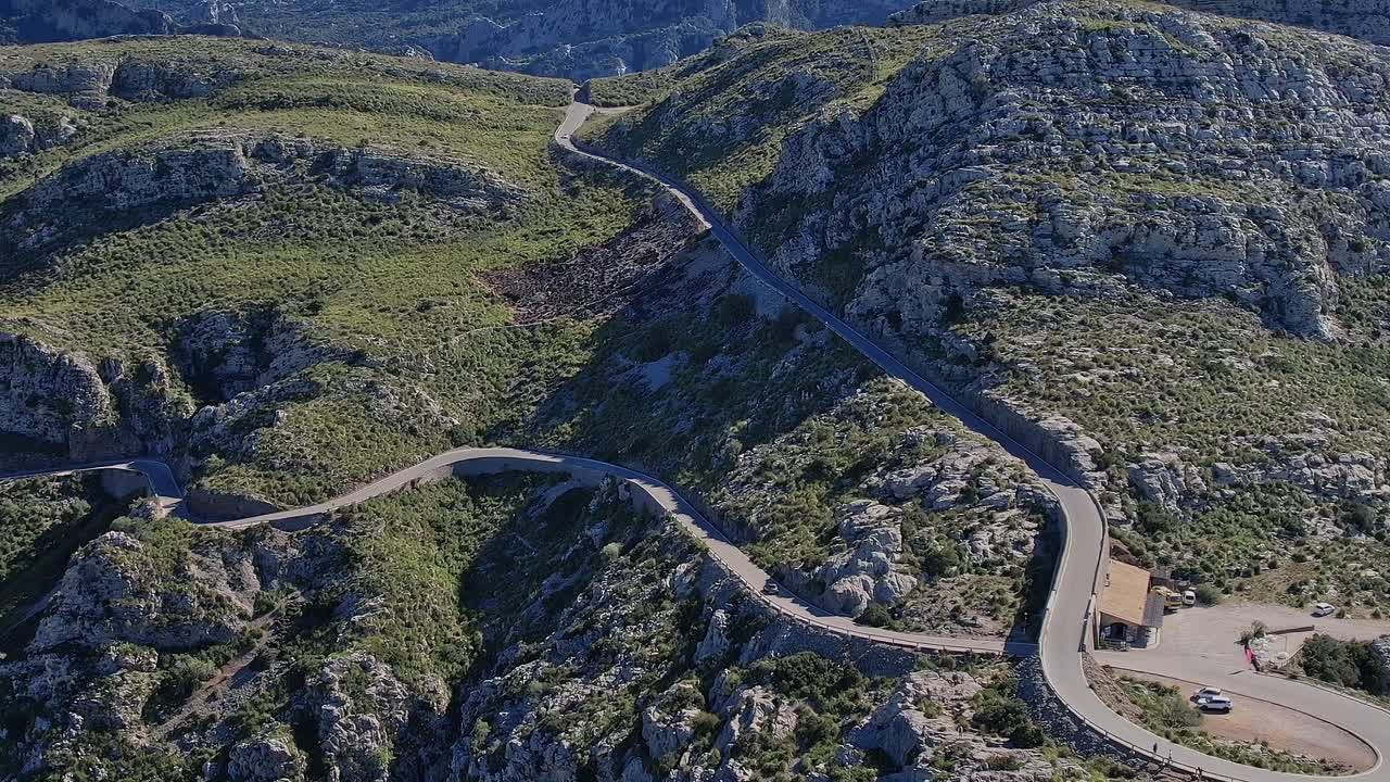 Winding road through rocky terrain in Mallorca, Spain, captured from above