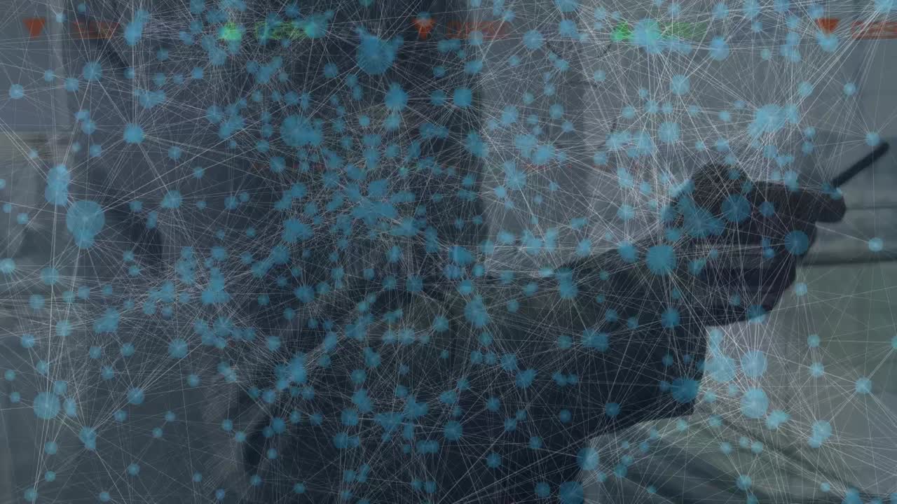 Animation of data processing over businessman walking in office