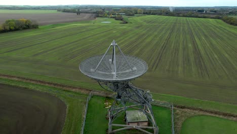 aerial view reveal over mullard mrao radio observatory telescope array on cambridge countryside