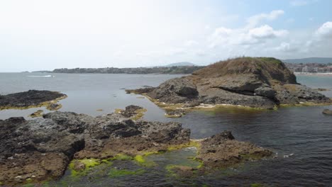 Drone-arc-footage-around-small-island-in-Black-sea,-Bulgaria-1