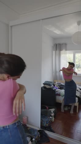 woman getting ready in a messy bedroom