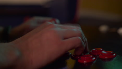 Close-up-of-hands-playing-an-arcade-machine