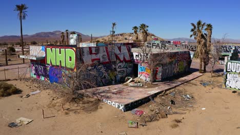 graffiti on beat up vacant buildings in the desert