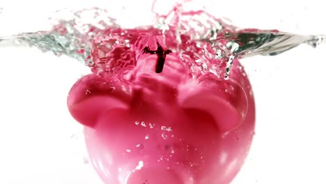 Piggy-bank-falling-into-water