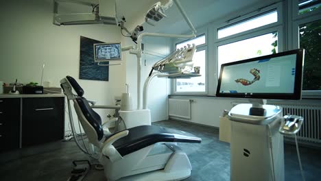 dentist office and dental chair in the middle of the room