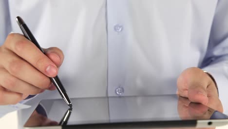 person using a tablet with stylus