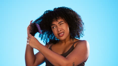 frustrated, knot and black woman with comb