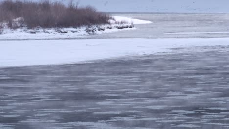 mist rising off icy winter river