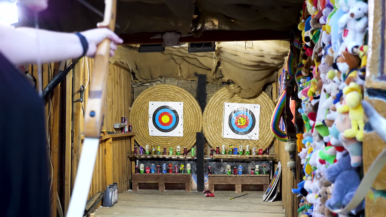 Bulgaria, VARNA, Golden Sand Resort - 20 AUGUST 2018 - Woman with an arch hitting the targets