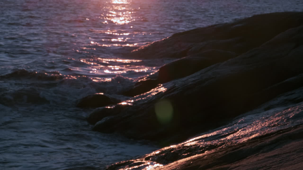 Mysterious Dark Ocean Rippling At Beautiful Golden Sunset Slow motion