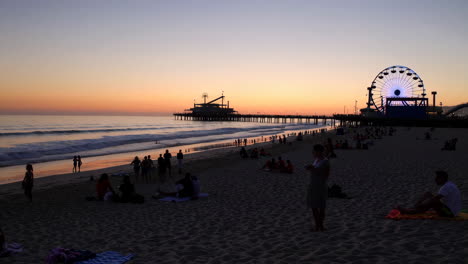 sunset at santa monica beach with pier and ferris wheel