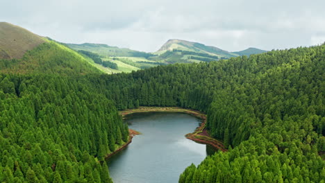 cinematic aerial drone shot of volcanic lake in the azores islands - portugal