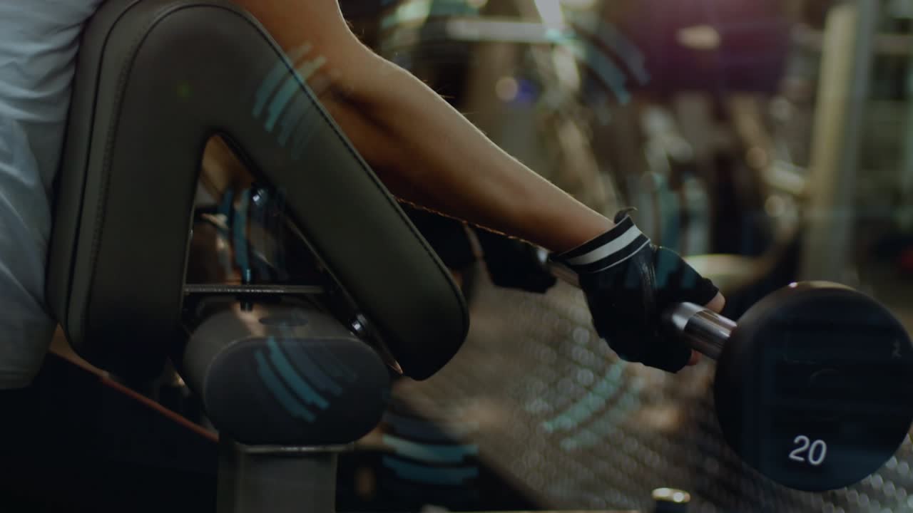 Woman resting elbow on curl bench, HUD syncing to curling dumbbell showing fitness metrics