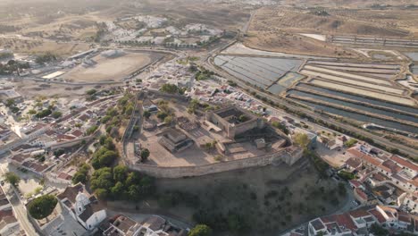 Aerial-dolly-in-shot-of-hillfort-Castro-Marim-castle-surrounding-by-salt-marsh-and-parish-village