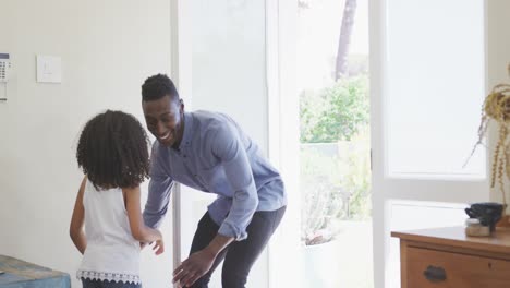 Africa-american-father-catching-his-daughter-and-hugging-her