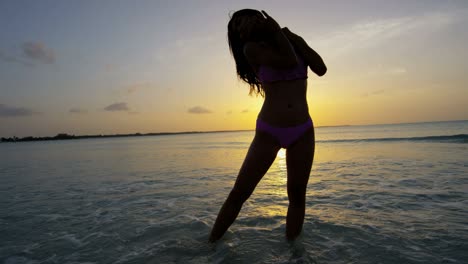 young asian chinese girl in swimwear on beach